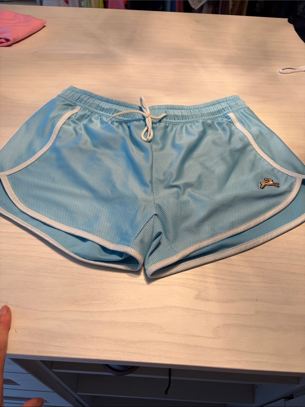 Tracksmith Womens Van Cortlandt Light Blue Mesh Athletic Shorts with cream trim